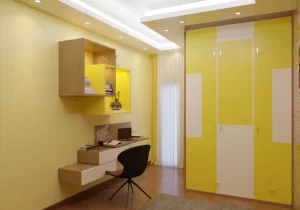 Modern luxury interior design of a study table and wooden shelf with yellow walls and lighting.